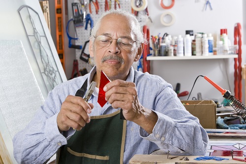 Man working with stained glass