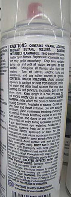 Back label of an art adhesive spray can. 