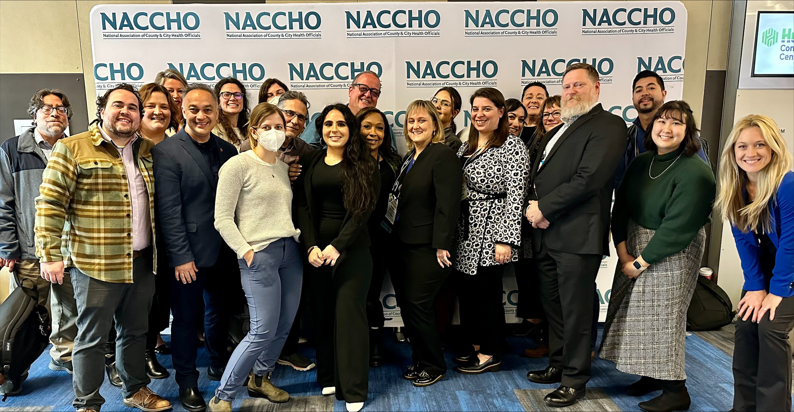 Dr. Shah posing with a group of people at a summit.