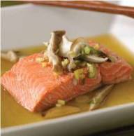 Cooked Asian-style steamed salmon on a plate. 