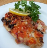 Baked tilapia with tomatoes.