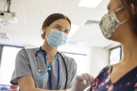 Health care worker and patient talking