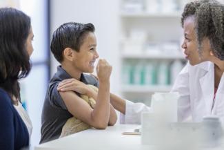 Vaccine provider with child patient