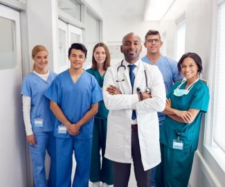 Medical providers standing and posing for the picture